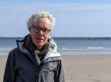 Harvard math professor Peter Kronheimer, recipient of the 2023 Steel Prize, at a beach.