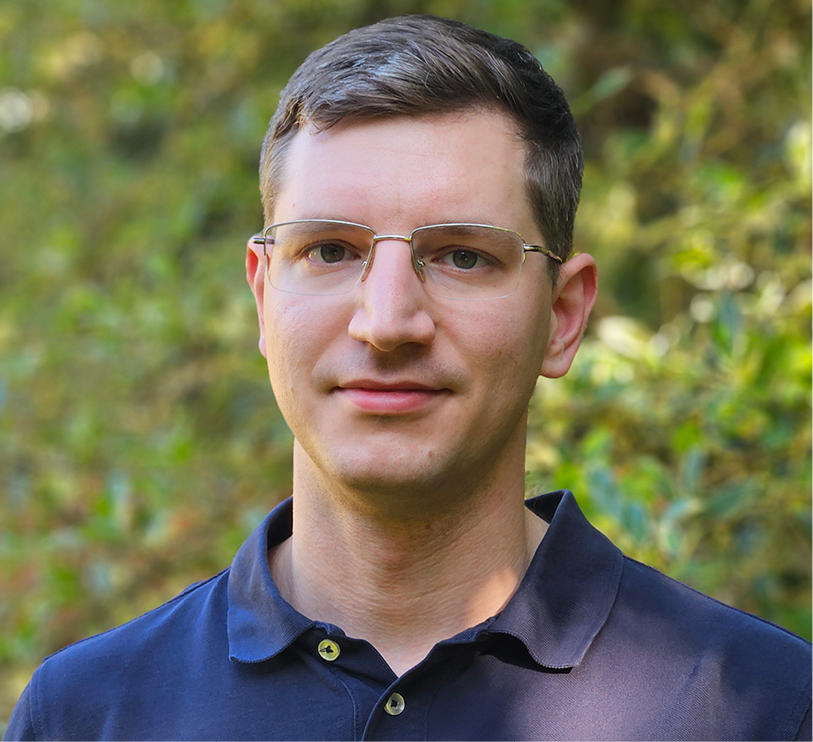 A headshot of Harvard math Bejamin Peirce Fellow Michael Szachniewicz.